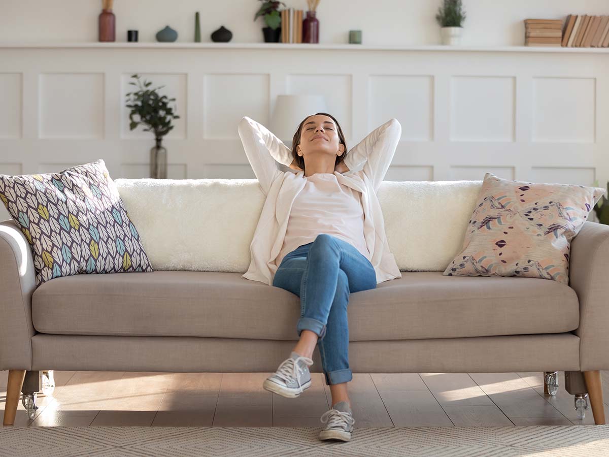 Relaxing in living room after cleaning hardwood flooring.