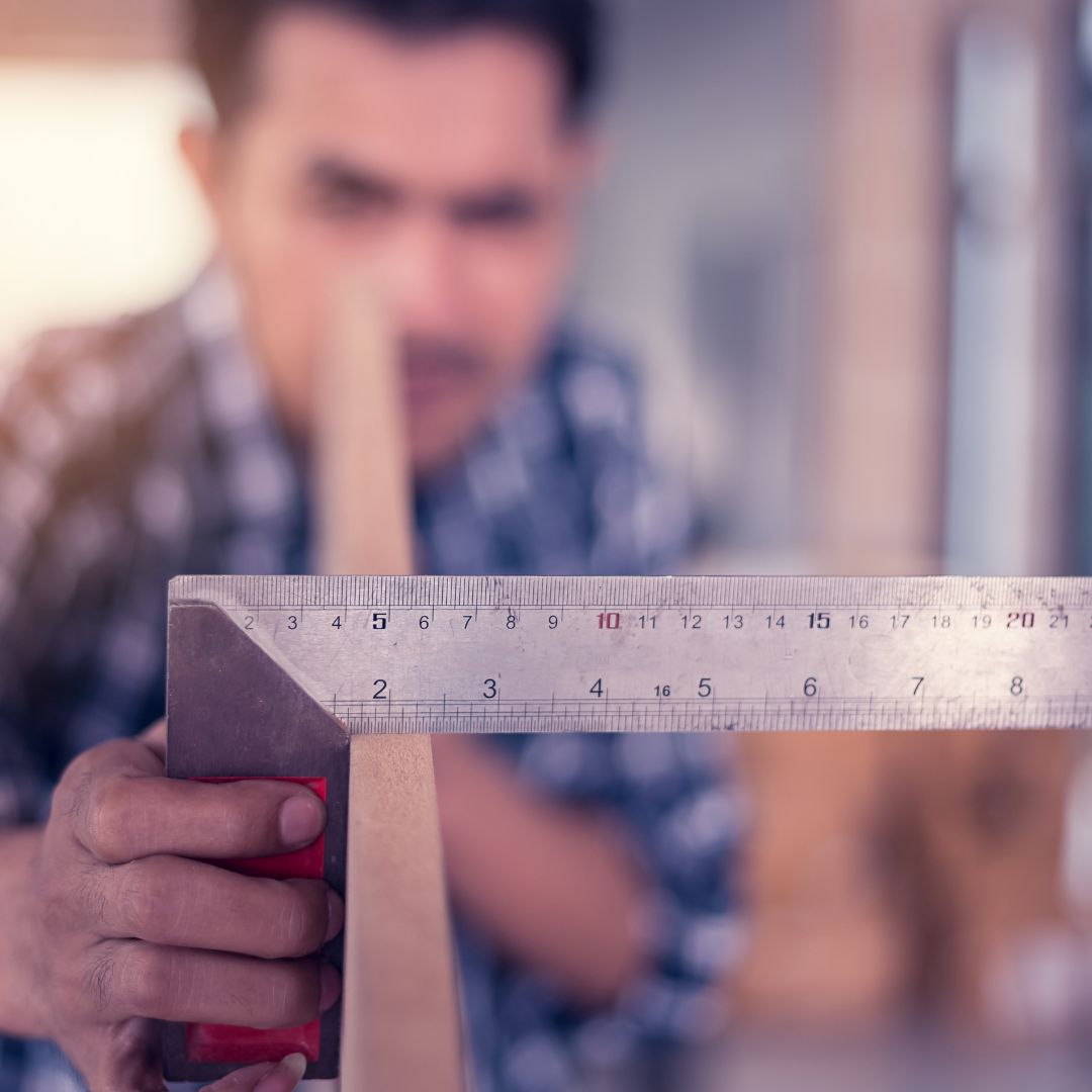 man checking quality of wood