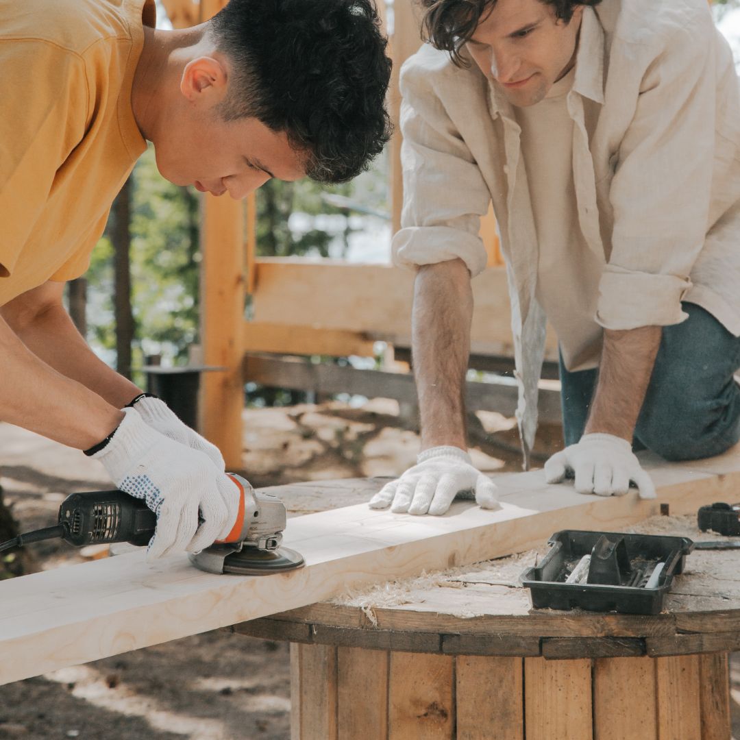 two men working with lumber